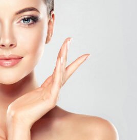 Radiant Skin Care. Close-up of a youthful woman with glowing, clear skin, demonstrating skincare and beauty treatments.