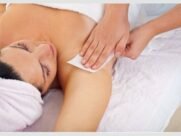Relaxing Spa Massage. Therapist gives a soothing massage on a woman's shoulder in a tranquil spa setting.